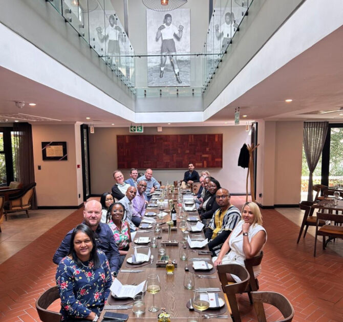 Group of people sitting at a roundtable event
